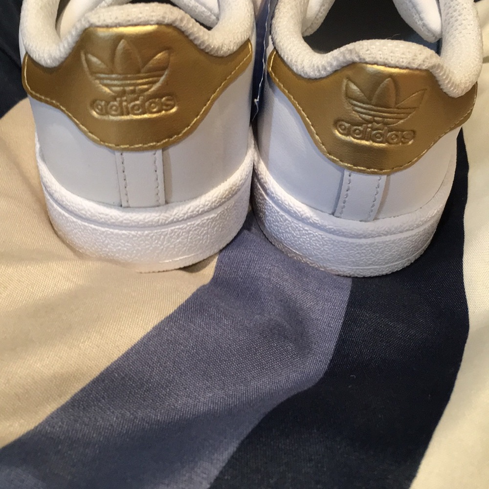 Brand new white/gold adidas never worn